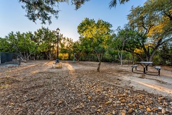 A park with a bench and a fence. at Bridge at Heritage Woods, Austin, TX, 78753